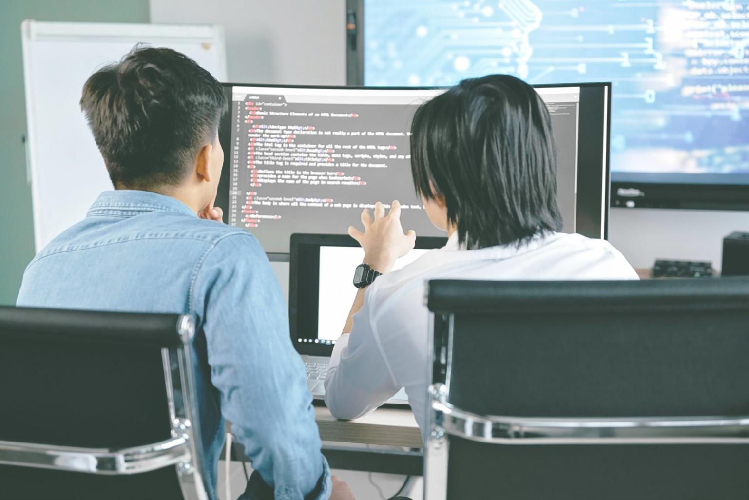 Professional blockchain development workspace with multiple monitors