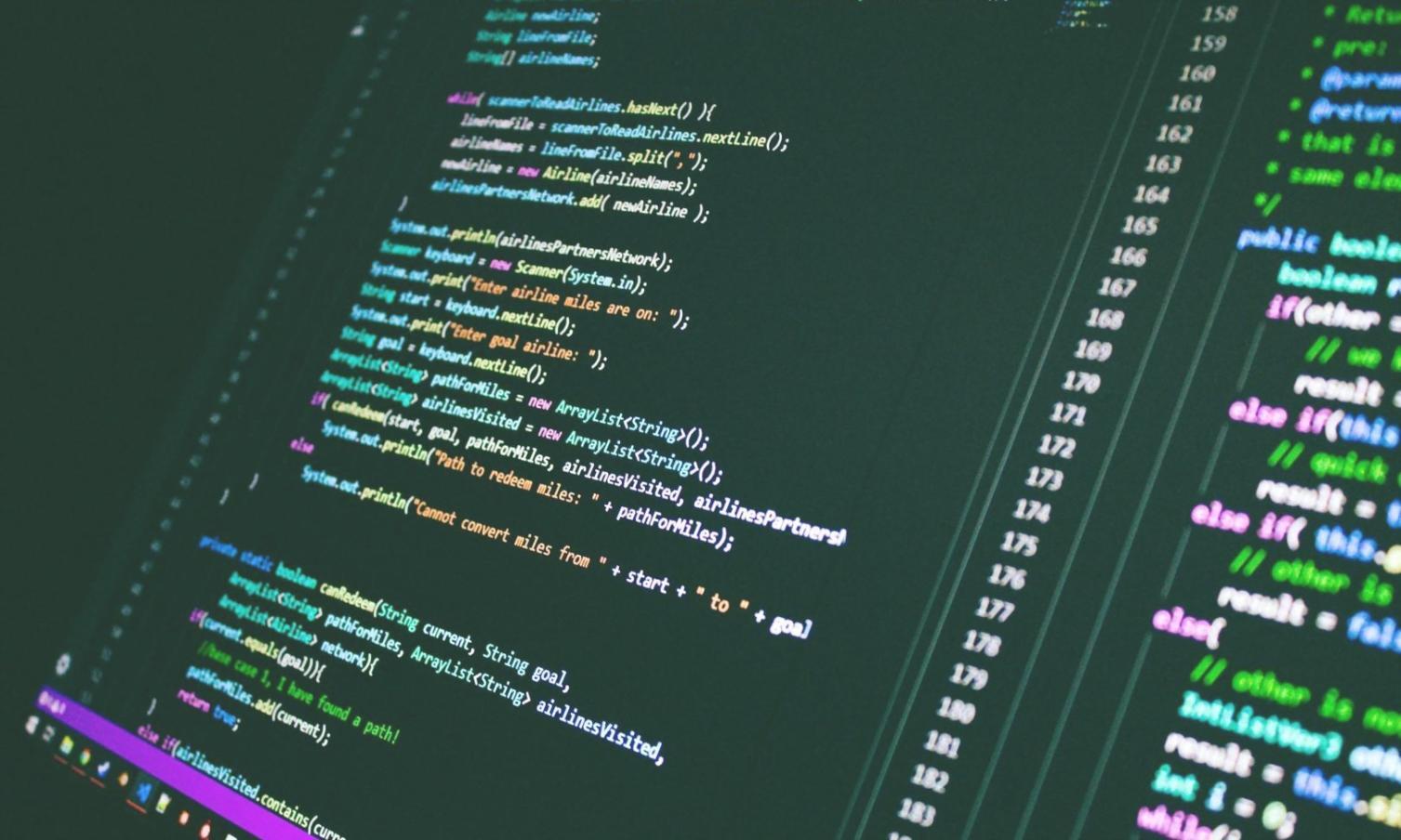 Modern blockchain development workspace with multiple monitors showing code and network visualizations