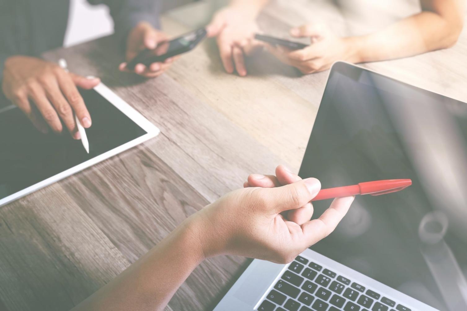 Students working on blockchain development projects in modern learning environment